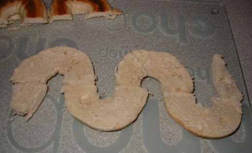 Sliced bagels forming monster snake
