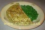 Omelette and peas on a plate
