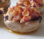 Mushrooms topped with pancetta tapa